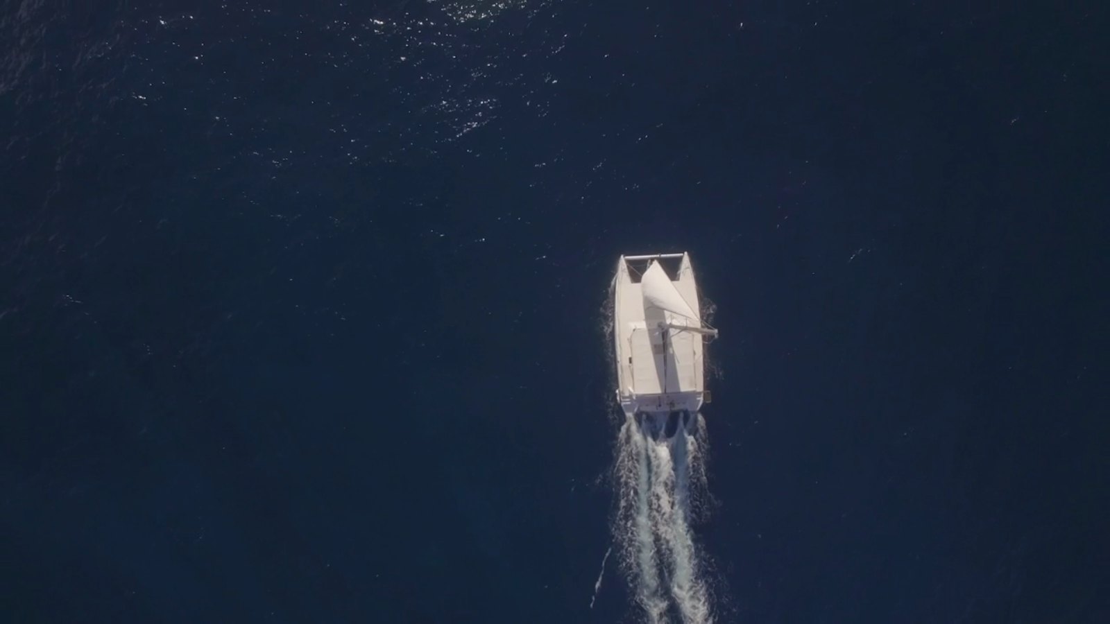 A yacht under way off the French Riviera